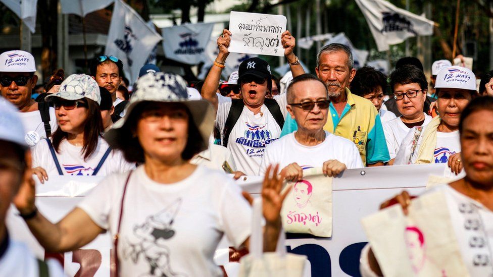 Supporters of Thailand's Prime Minister Prayut Chan-o-cha in pro-government walk at a park in Bangkok