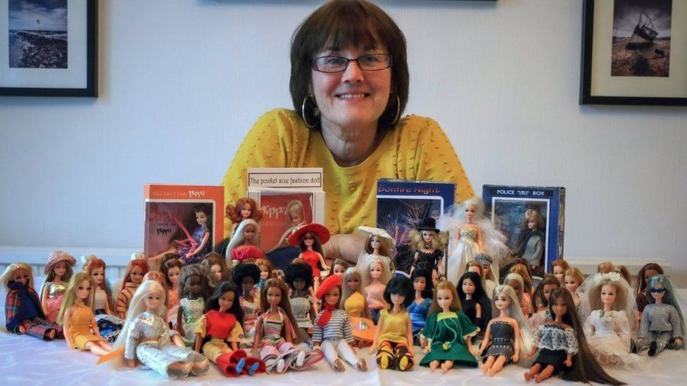 Heather Swann with her collection of Pippa dolls