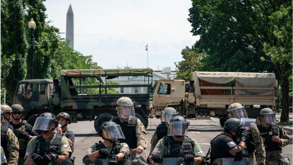 Police forces and National Guard vehicles are used to block 16th Street near Lafayette Park and the White House