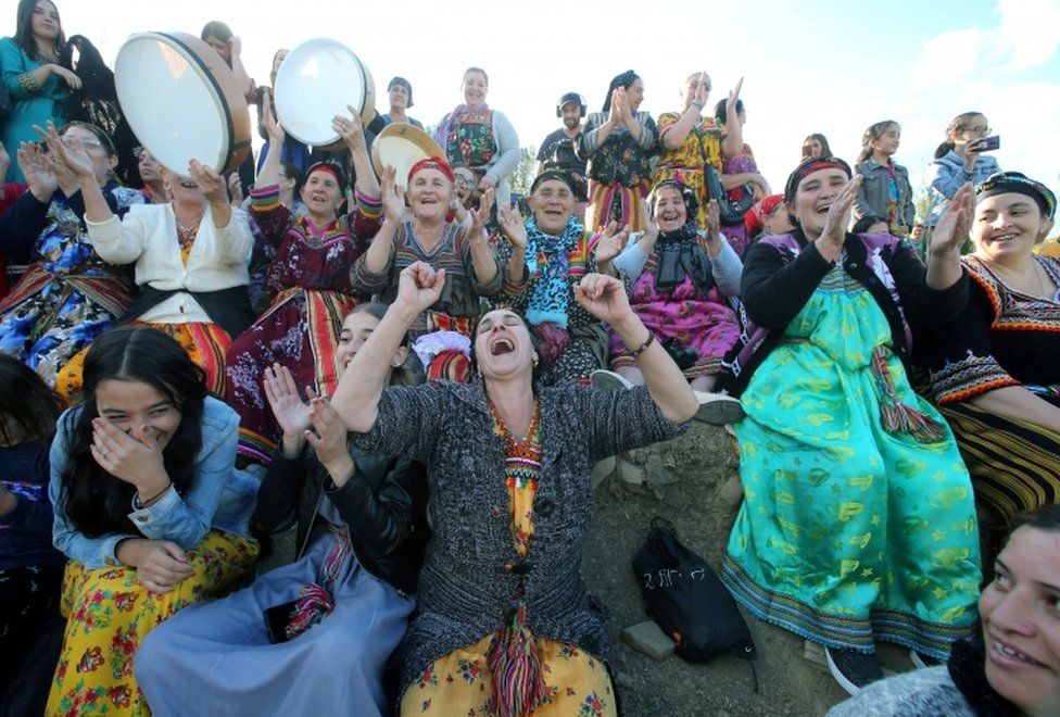Women spectators cheer during a match in an annual local soccer tournament played by an all women teams, at the village of Sahel, in the mostly Berber Kabylie region in the mountains east of Algiers, Algeria October 16, 2020.