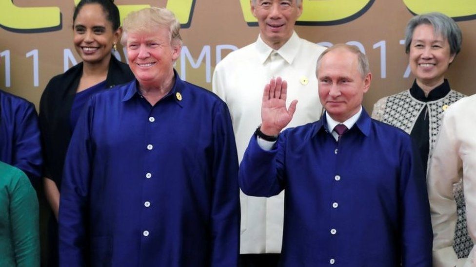 US President Donald Trump and Russian President Vladimir Putin take part in a family photo at the APEC summit in Danang, Vietnam, 10 November 2017