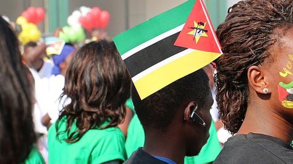 Mozambicans displaying the national colours