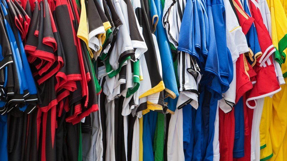 Football shirts on a rack