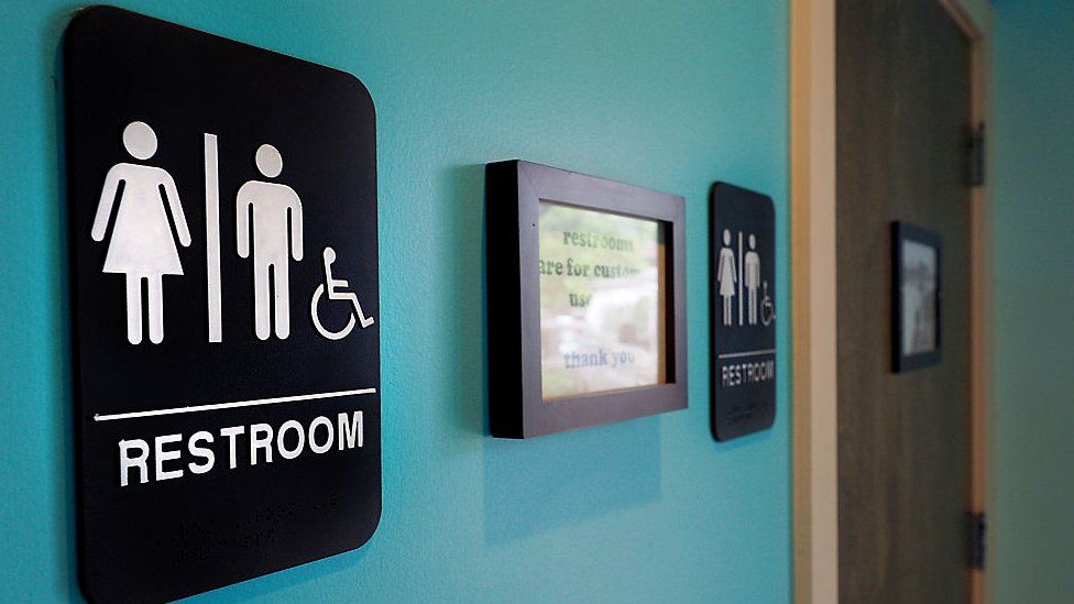 Unisex signs hang outside bathrooms in Durham, North Carolina.