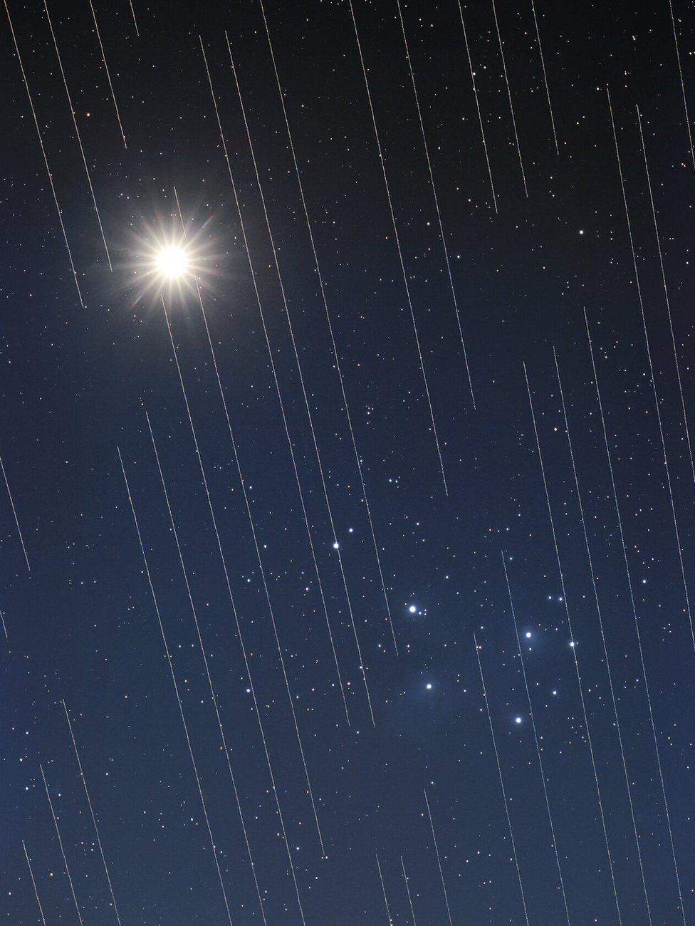 This image of Venus and the Pleiades shows the tracks of Starlink satellites