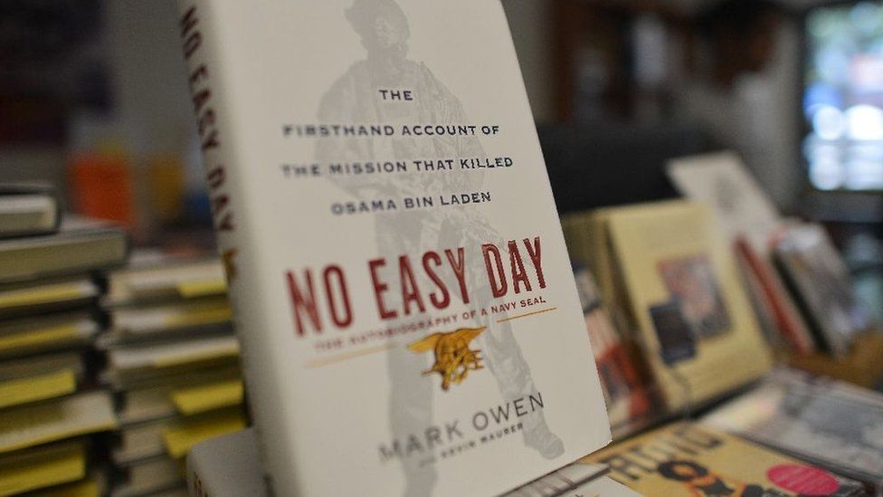 Copies of a book by former Navy SEAL titled No Easy Day are seen on display at a bookstore in Washington, DC