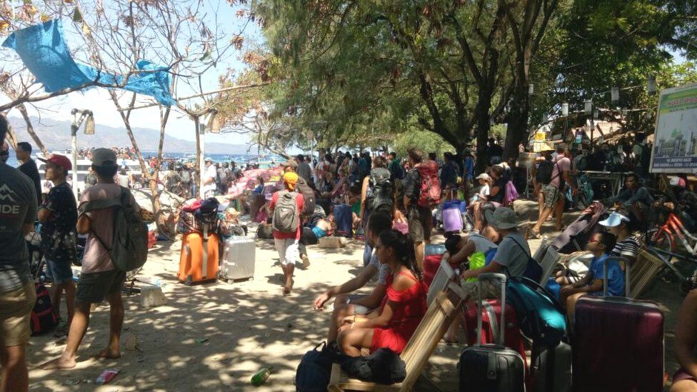 People waiting to evacuate Gili Air, one of the Gili islands