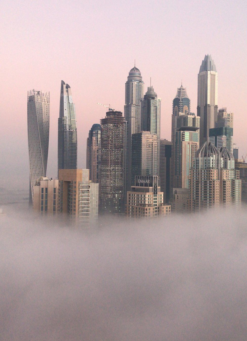 Skyscrapers in Dubai amongst the mist