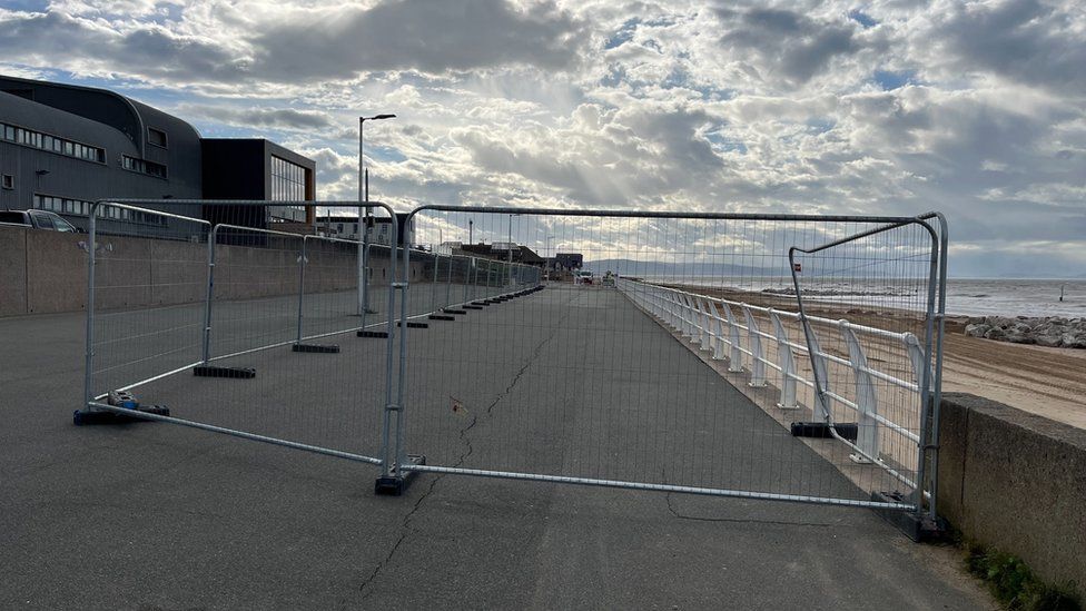 Fencing on Rhyl promenade near the area where the hole appeared