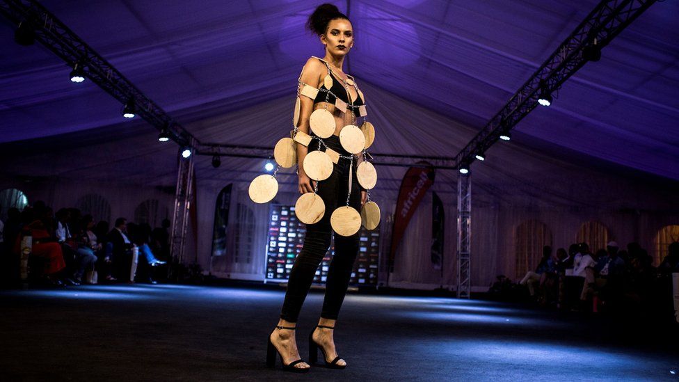 A model displays a creation by Congolese fashion designer during the Kinshasa Fashion Week on October 13, 2017 in Kinshasa