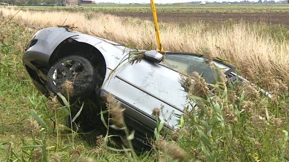 Car being winched out of ditch