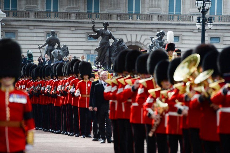 The Coldstream Guards are seen near Buckingham Palace during the procession for the Lying-in State of Queen Elizabeth II