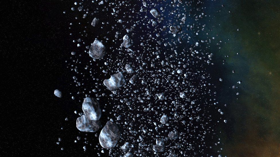 An illustration of icy rubble floating in space