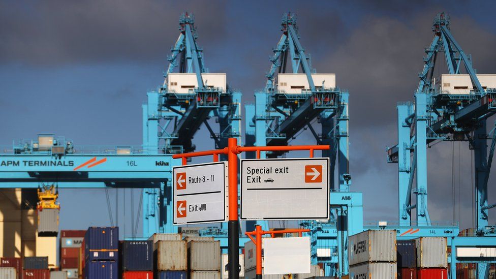 A general view of shipping containers and cranes which move them at the Port of Rotterdam