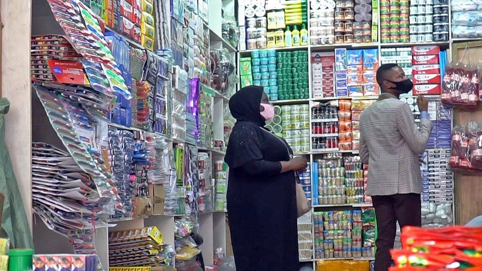 A woman shopping in a retail store in the Republic of Congo