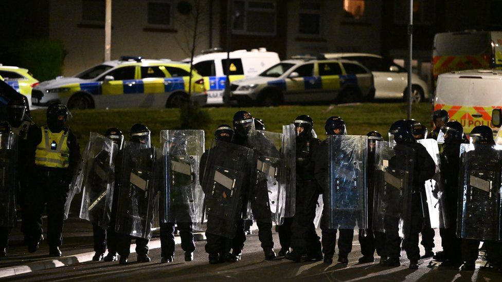 Police in riot gear on Monday in Ely