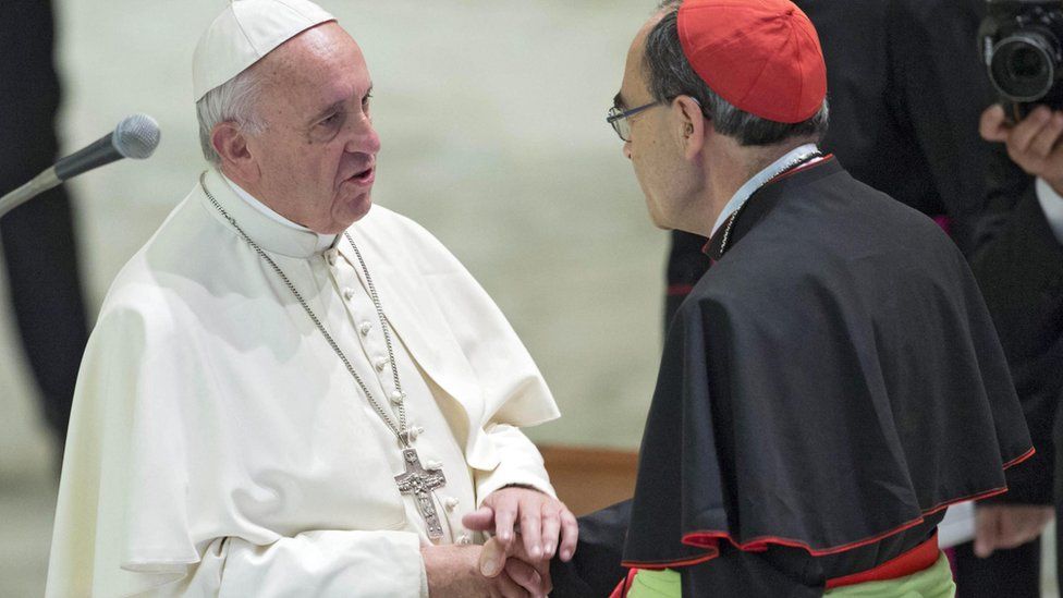 Pope Francis (L) welcomes Archbishop of Lyon Philippe Barbarin (R) during a Jubilee audience with pilgrims from Lyon in Paul VI Hall, Vatican City (6 July 2016)