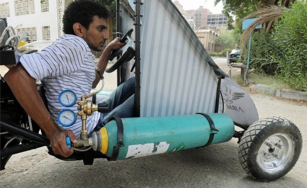 Mahmoud Yasser, mechanical engineering student from Helwan University, drives an air-powered vehicle in Cairo, Egypt - Tuesday 7 August 2018