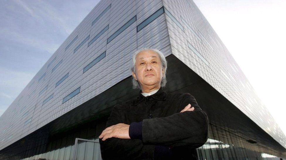 Japanese architect Arata Isozaki poses in front of the Palahockey designed with Italian architect Pier Paolo Maggiora in Turin, Italy, on 20 December 2005