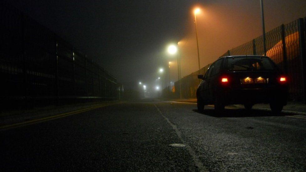 night time street scene with old car by Scott Ewart