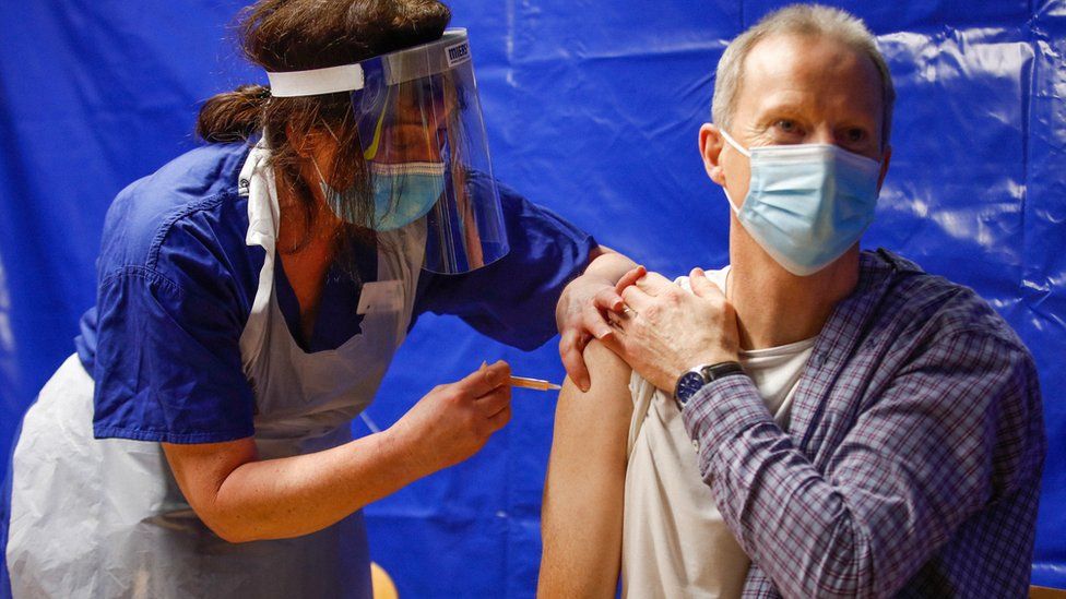 A man receives a Covid-19 vaccine at the vaccination centre at the Bournemouth International Centre in January