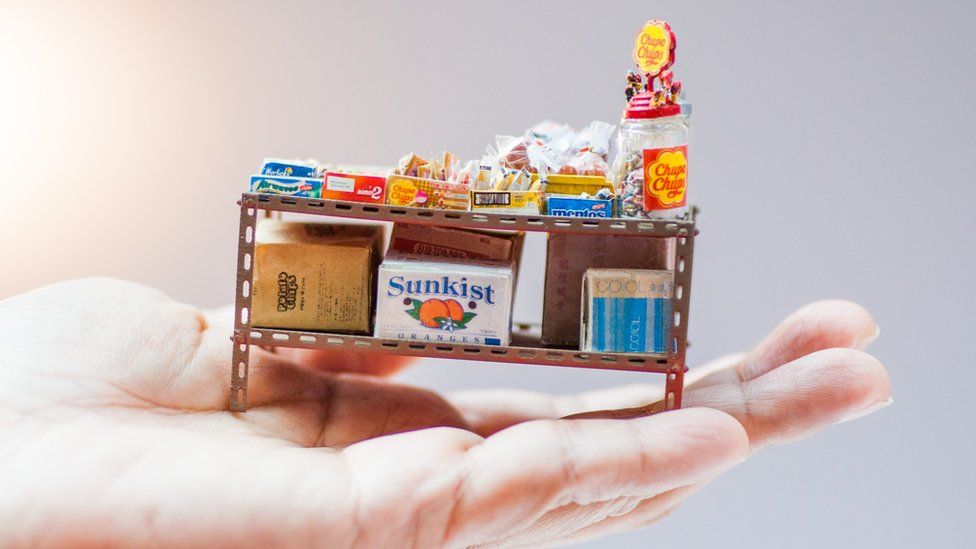 Miniature shelves full of snacks