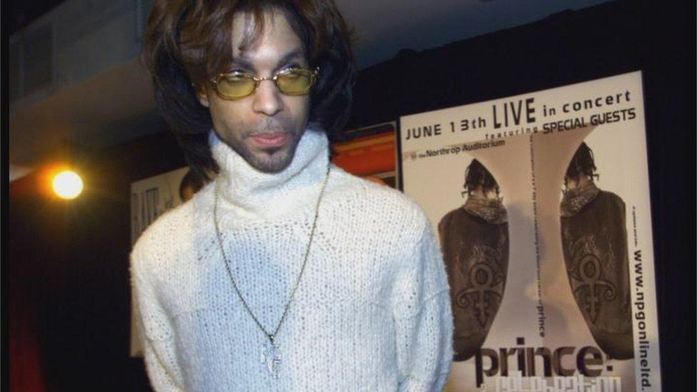 Recording artist Prince leaves the stage after a news conference where he announced that he now will be known as Prince, and not the unpronounceable symbol that he has been using in recent years, Tuesday, May 16, 2000 in New York.