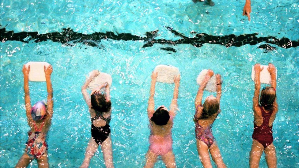 Children in a swimming lesson