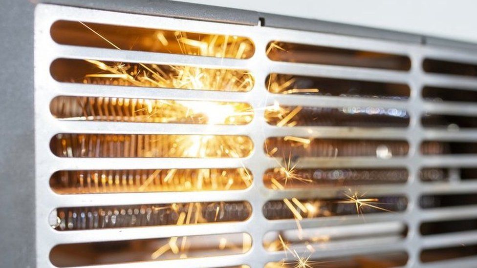 Stock image shows sparks inside an electric fan heater