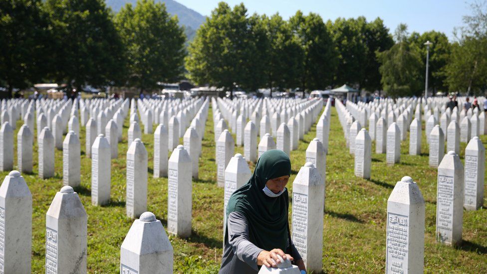 A woman at a graveyard