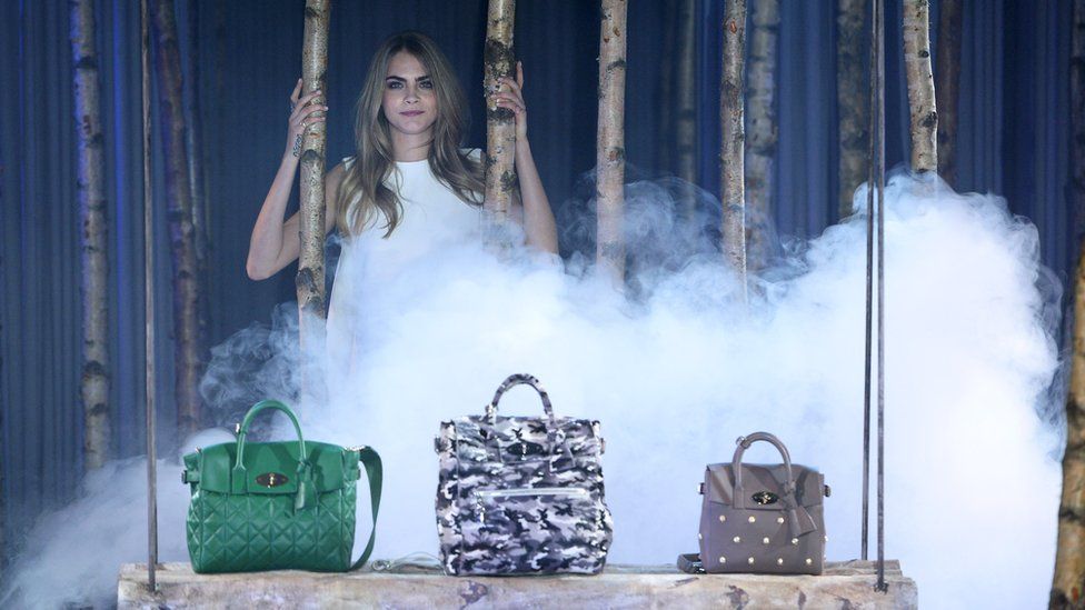 Cara Delevingne with Mulberry bags