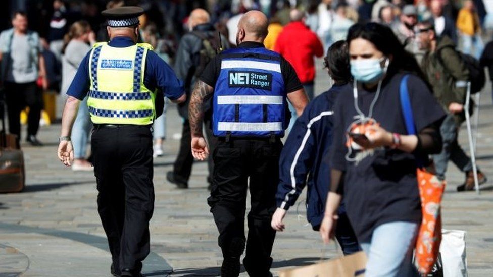 A street ranger and a police community support officer patrol Newcastle