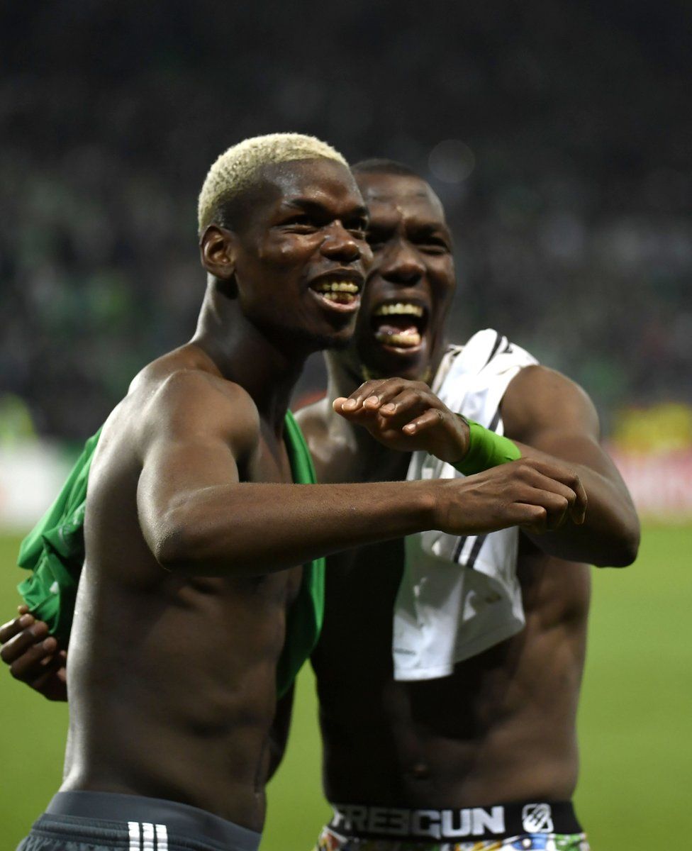 Manchester United's French midfielder Paul Pogba (left) and his brother - St Etienne's Guinean defender Florentin Pogba