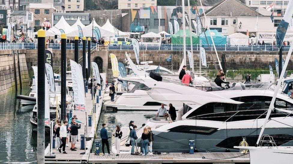 Visitors looking at some of the boats on display at the show