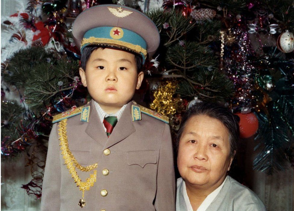 Kim Jong-nam dressed in an army uniform, poses with his maternal grandmother in January 1975 in an unknown place.