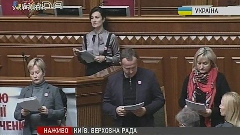 Mps perform the play 'Seven' on the floor of the country's parliament