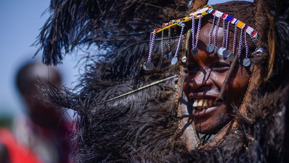 A performer from the Maasai Community gestures during the International Day of the World's Indigenous Peoples at Sekenani Camp in Masai Mara, Kenya on August 08, 2023.