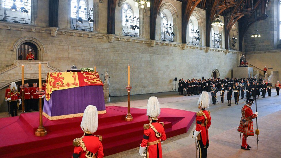 The coffin of Queen Elizabeth II lies on the catafalque in Westminster Hall watched on by guards and members of the Royal Family