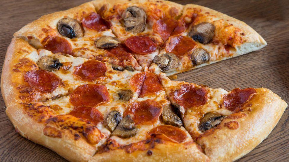 A pepperoni and mushroom pizza