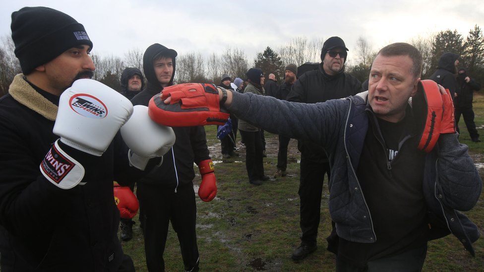 Members of the Alpha Men Assemble work out with boxing gloves and pads for fitness for team building on January 8, 2022 in Brownhills, England.