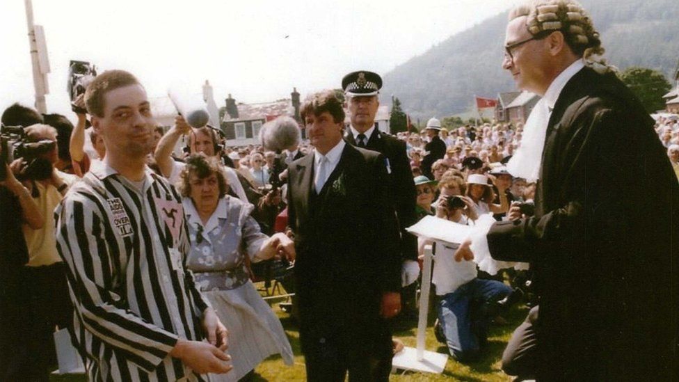 Alan Shea handing over a petition at Tynwald Hill in 1991