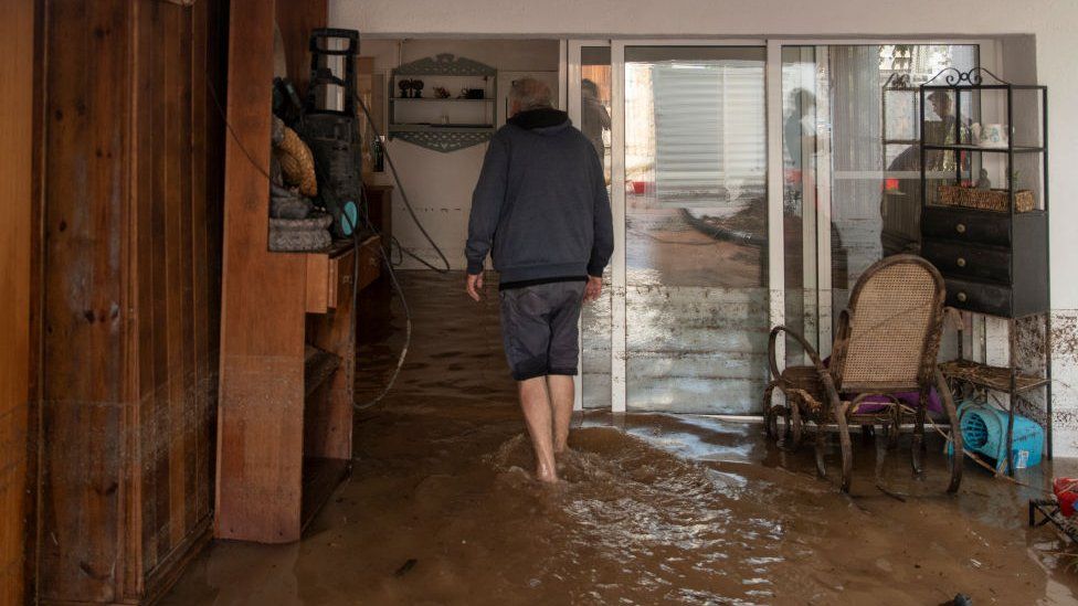 A man in his house flooded by the rains, on September 3, 2023, in Les Cases d'Alcanar, Tarragona, Catalonia, Spain. The DANA, which arrived on September 1, has brought heavy rainfall to much of the Peninsula and the Balearic Islands