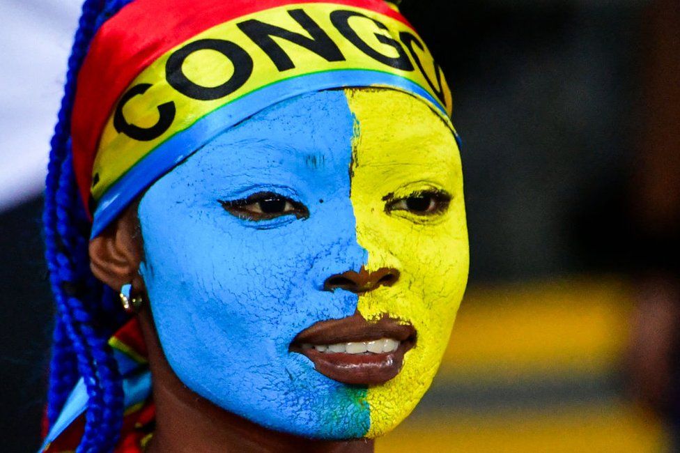 A woman with face paint watched DR Congo beat Guinea in the Africa Cup of Nations.