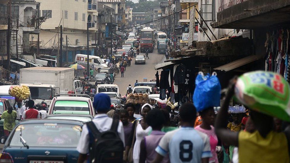 People walking in a street in Freetown, Sierra Leone