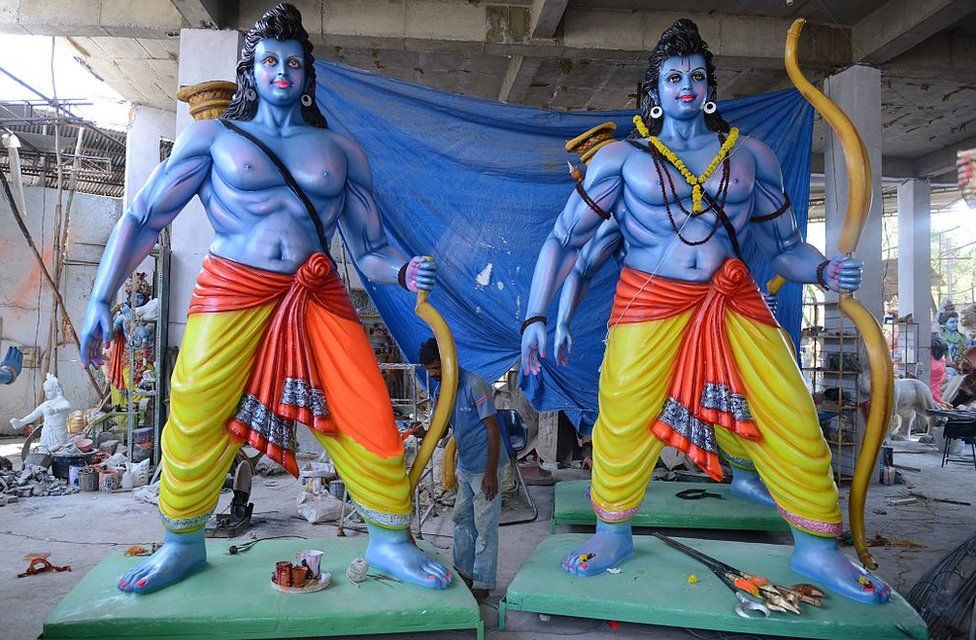 An Indian artist puts final touches to statues of the Hindu God Lord Ram in Hyderabad on April 13, 2016