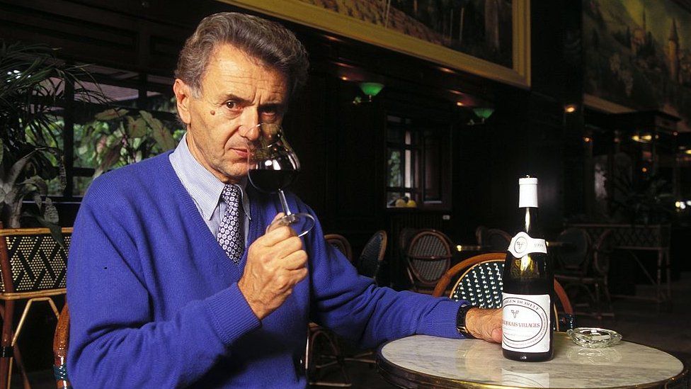 Georges Duboeuf drinking a glass of Beaujolais in 1995