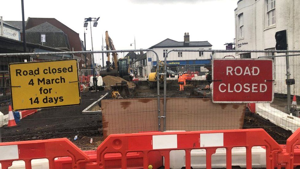 Excavation work taking place in March town centre, with a road closed off by workmen