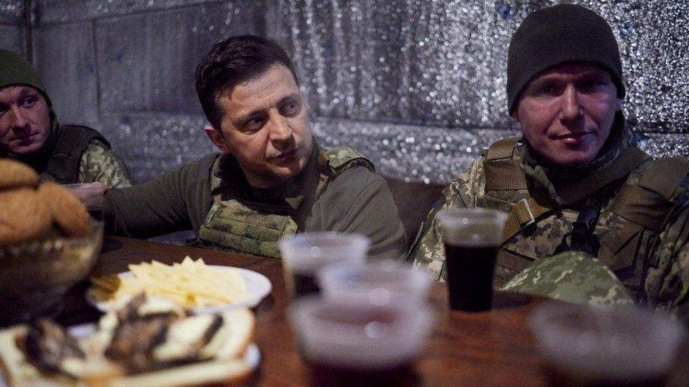 Ukrainian President Volodymyr Zelenskiy meets with service members of the country"s armed forces at combat positions near the line of separation from Russian-backed rebels in the Donetsk region