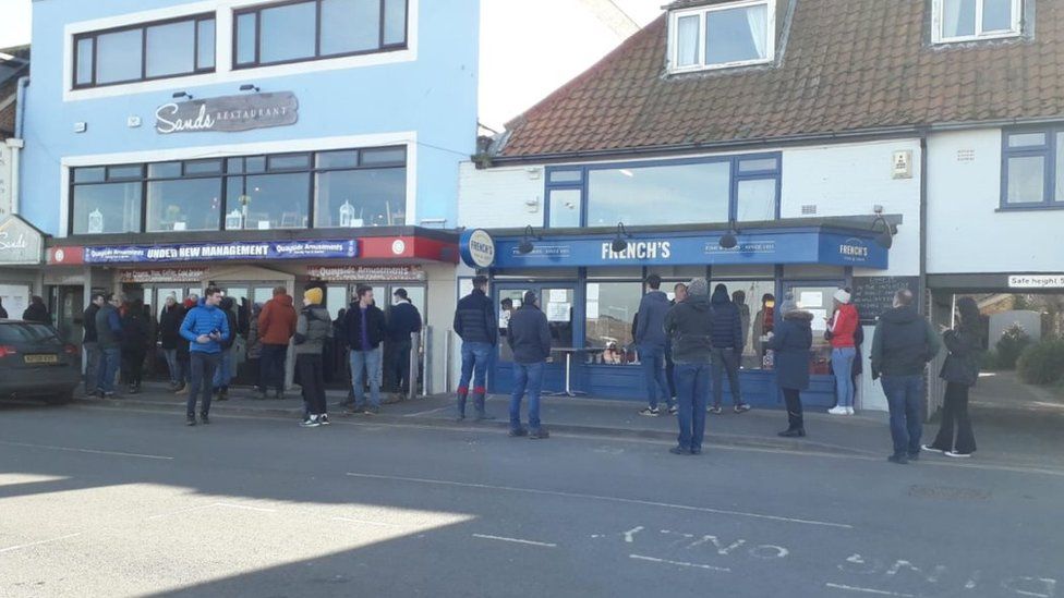 People outside fish and chip shop in Wells-next-the-Sea