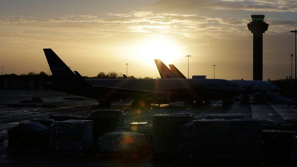 Sun rise over the control tower and cargo terminal at Stansted Airport